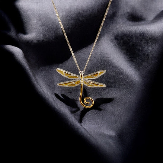 Gold dragonfly pendant with white-gold chain from RossJewelrys on dark silk background.

