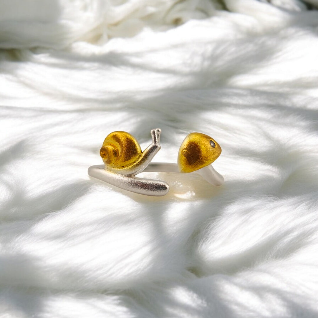 Frontal view of adjustable snail ring with detailed head and shell