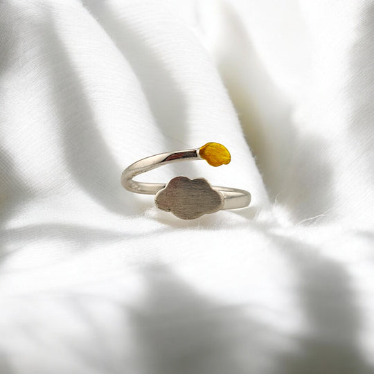 Silver ring with matte cloud and glossy yellow raindrop from above