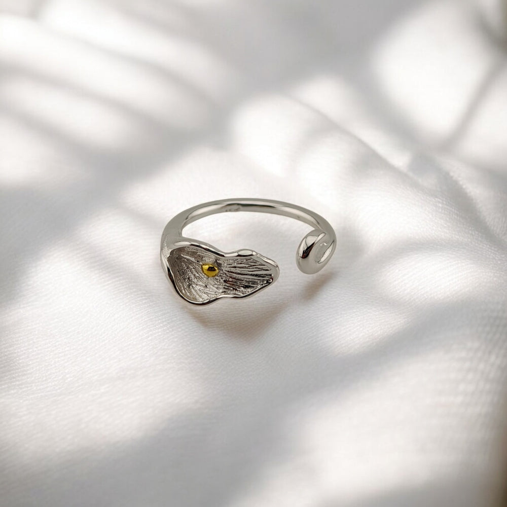 Front angle of calla lily-shaped adjustable silver ring with petal texture