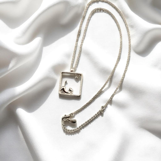 Eco-conscious puppy necklace with clean modern design