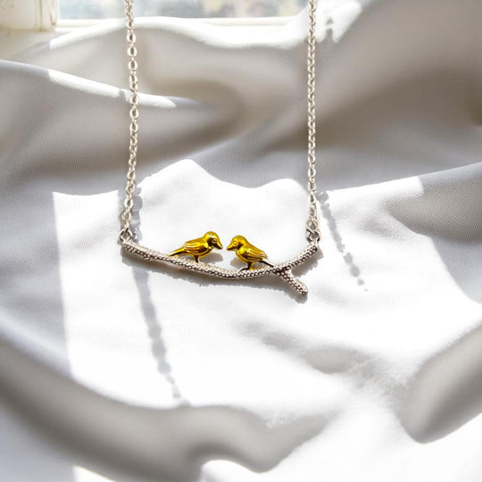 Eco-friendly bird necklace with yellow birds and silver branch