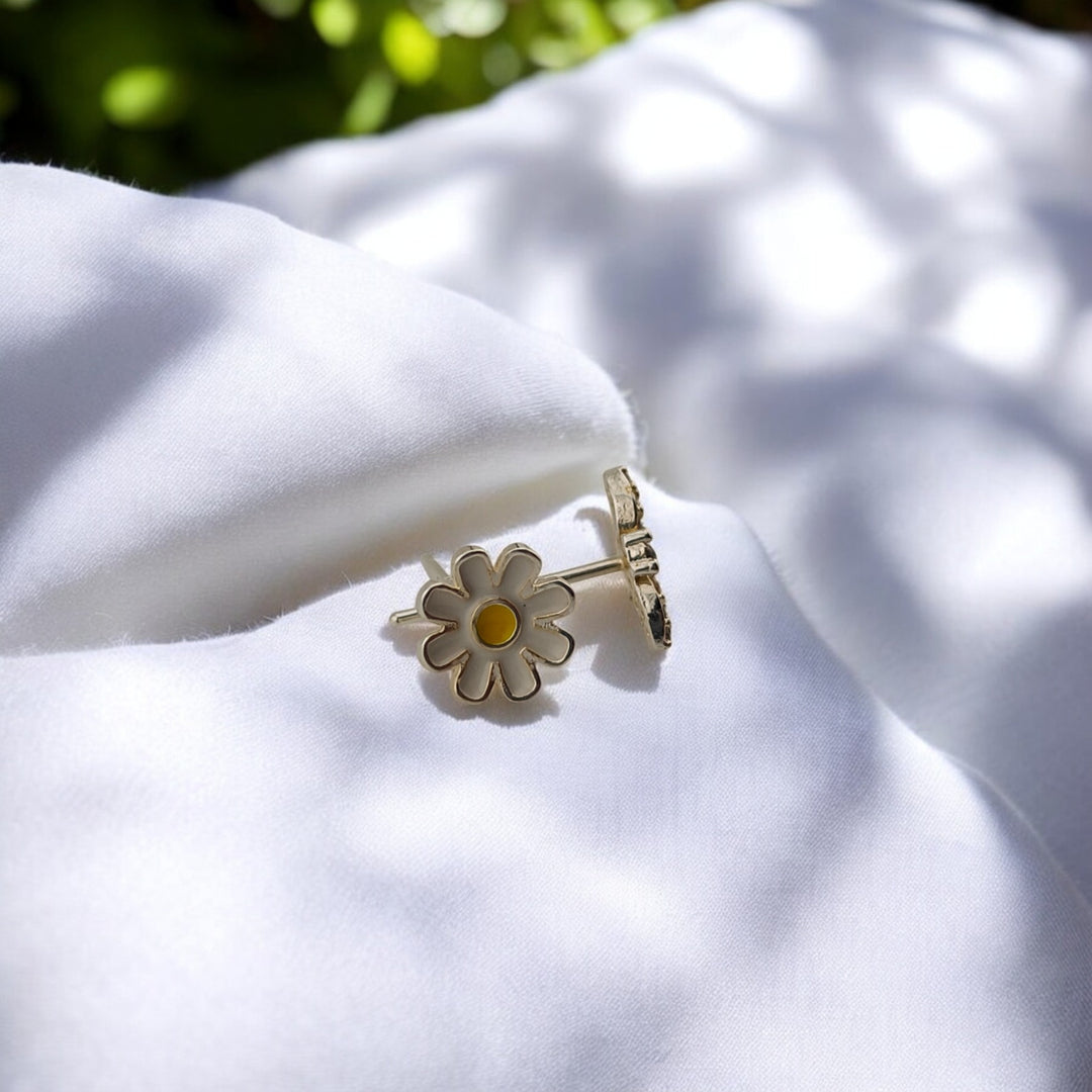 Front view of daisy and bee earrings side by side

