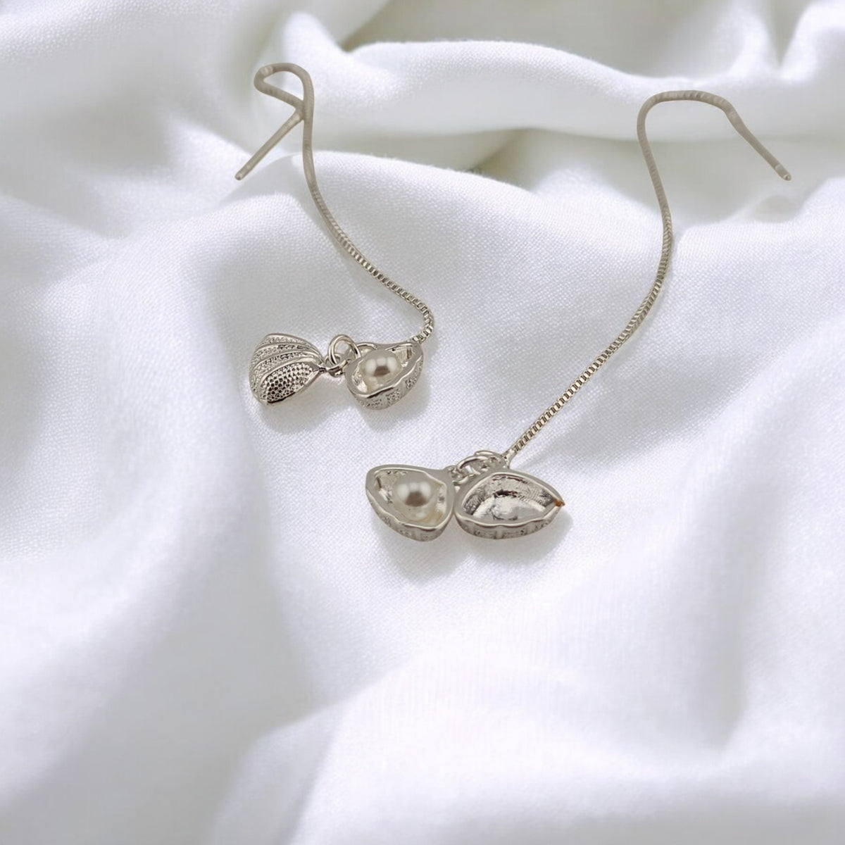 Eco-friendly dangling seashell earrings featuring pearls