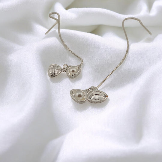 Eco-friendly dangling seashell earrings featuring pearls