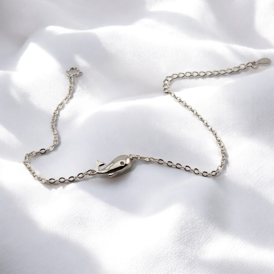 Eco-friendly silver bracelet with whale charm spread open
