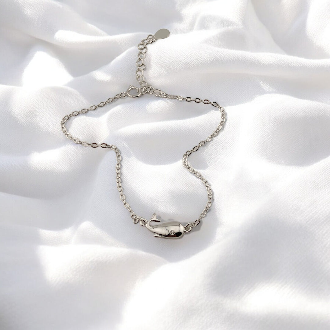 Delicate silver bracelet with a whale pendant, inspired by marine life