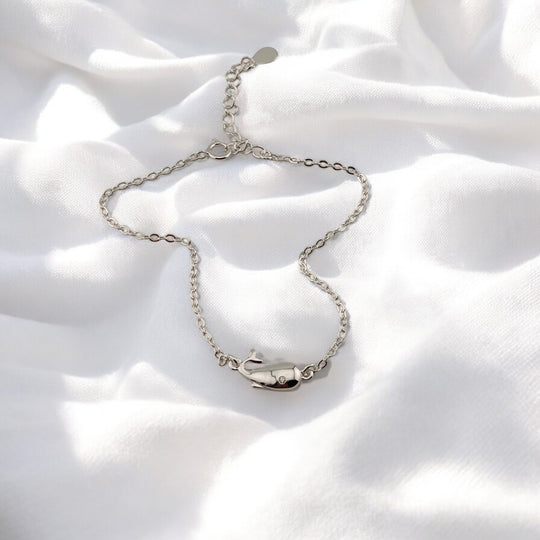 Delicate silver bracelet with a whale pendant, inspired by marine life