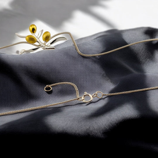 Elegant white-gold olive branch necklace with golden olive details – RossJewelrys