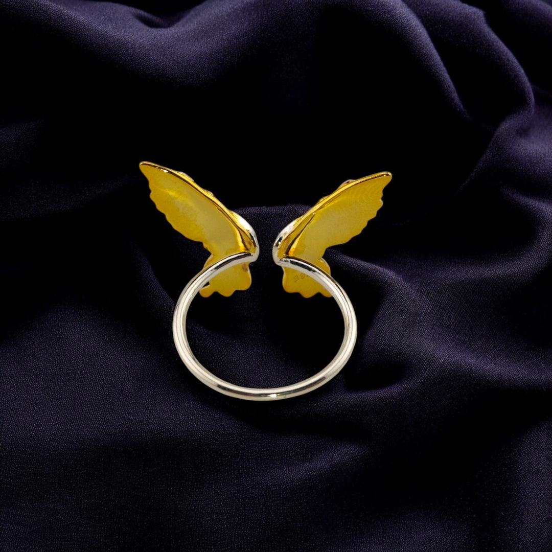Back view of the butterfly ring revealing the smooth band

