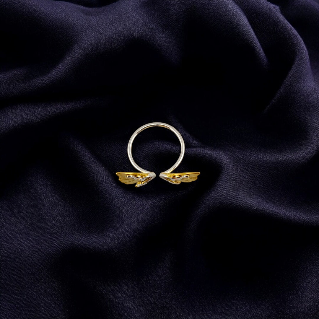 Top angle showing butterfly wing details and open ring design


