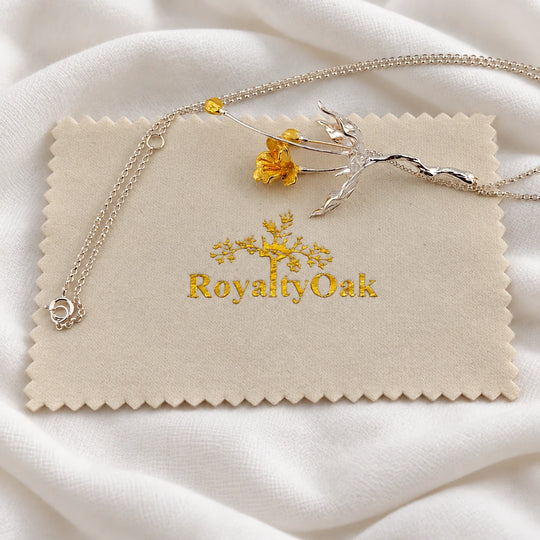 RoyaltyOak jewelry polishing cloth with a necklace resting on the cloth
