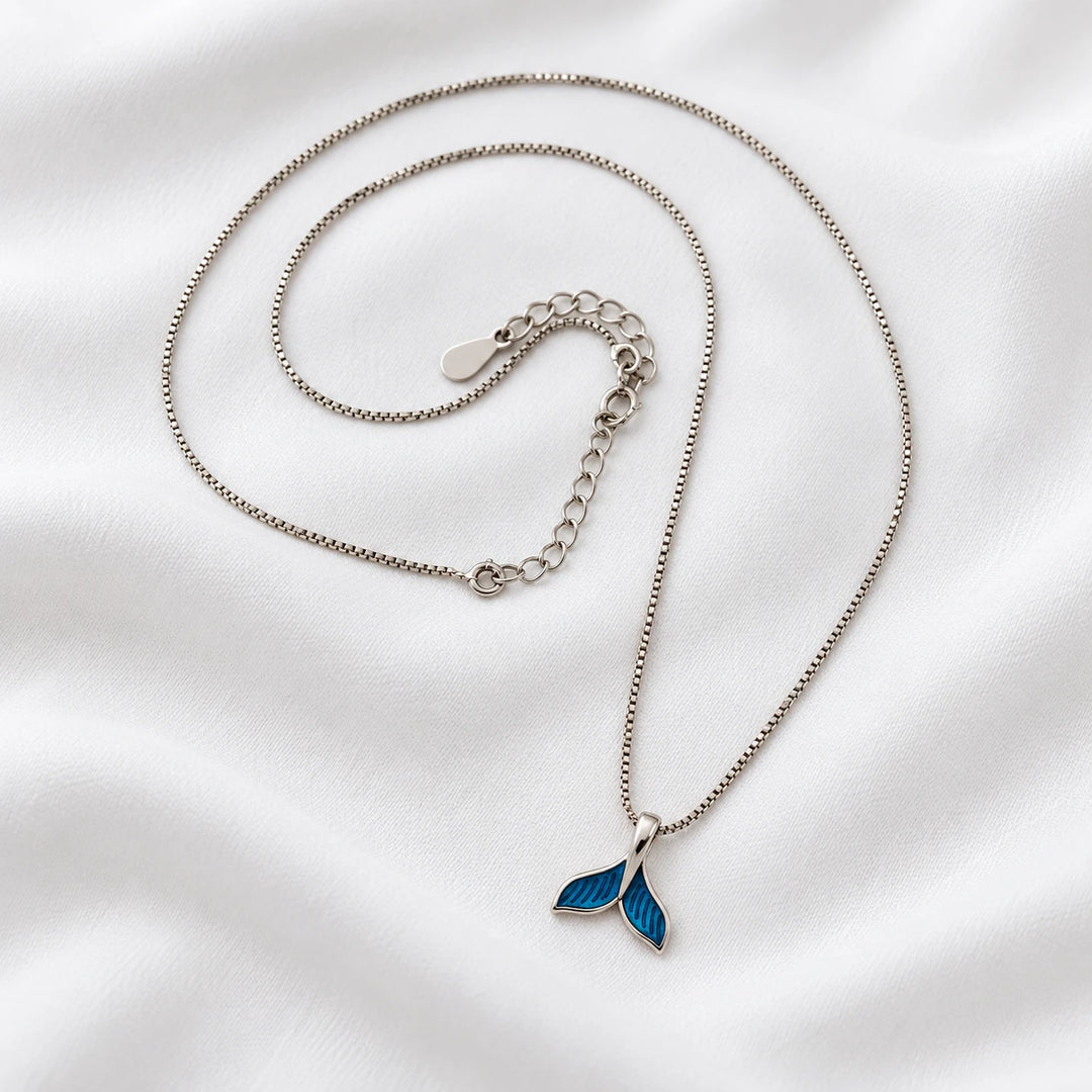 Dolphin tail necklace with a blue tail pendant, silver-tone chain and extension links