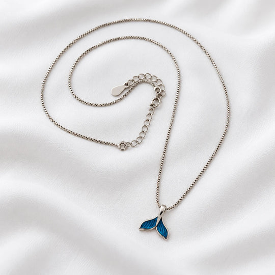 Dolphin tail necklace with a blue tail pendant, silver-tone chain and extension links