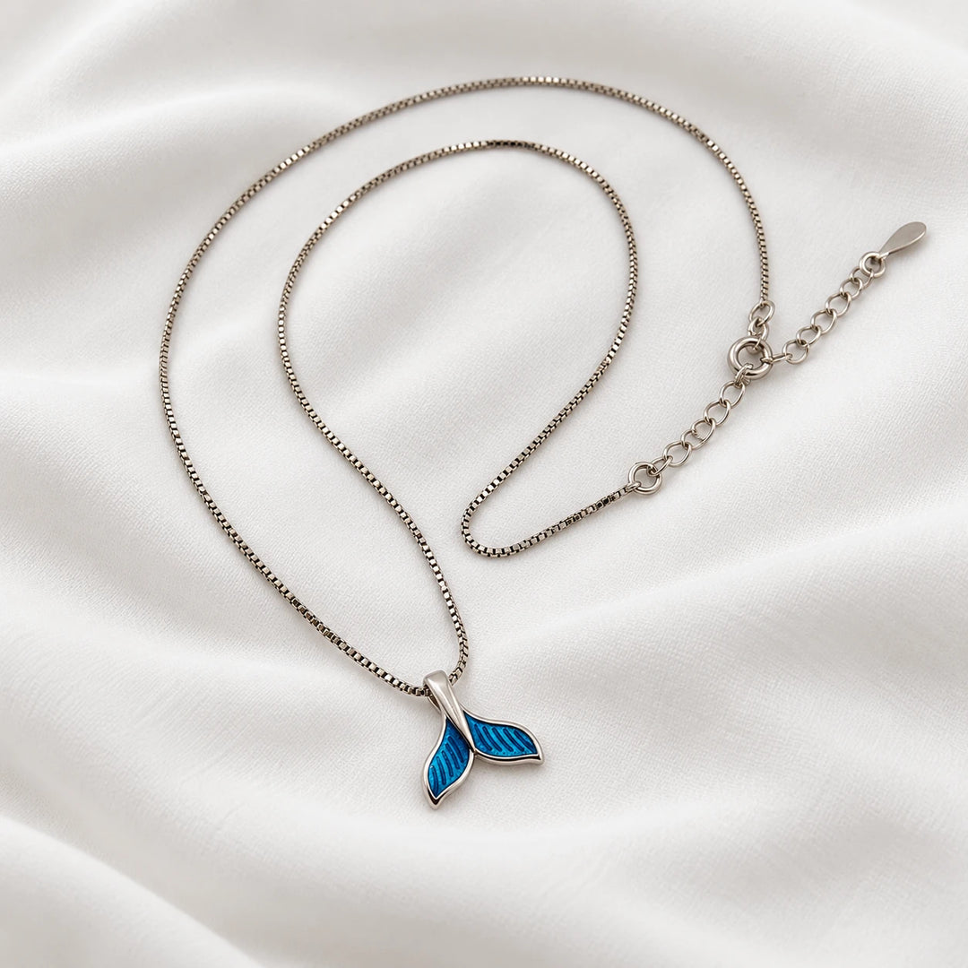 Dolphin tail necklace showing its blue pendant, clasp and extension chain