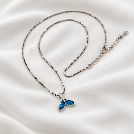 Dolphin tail necklace showing its blue pendant, clasp and extension chain