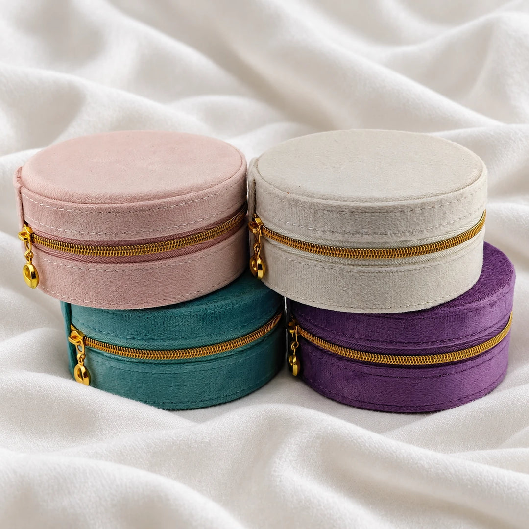 RoyaltyOak velvet travel jewelry cases in pink, cream, teal and purple