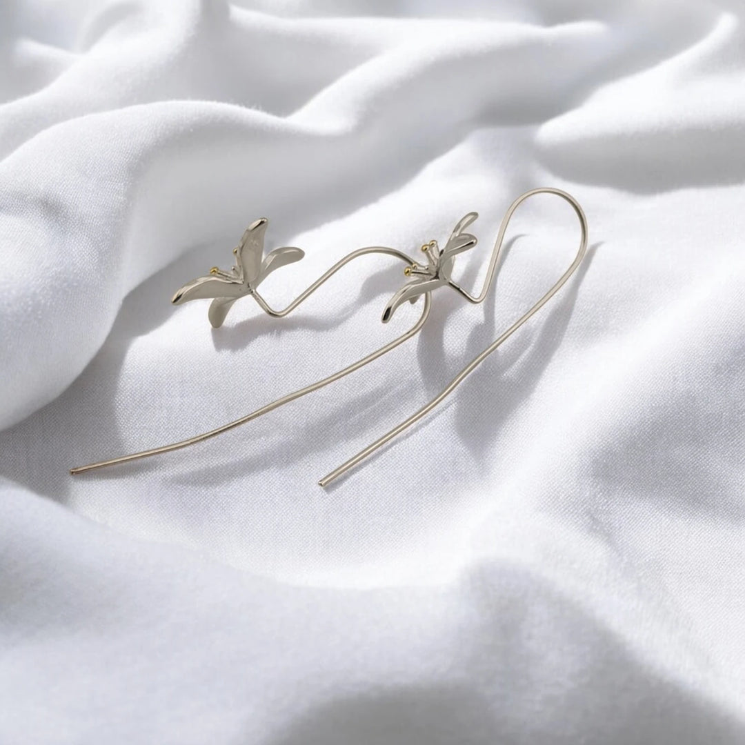 Trumpet flower earrings showing their sculpted flowers and long curved wires